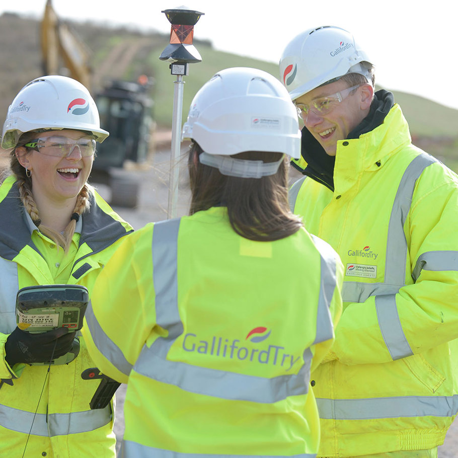 Image of three people on a building site